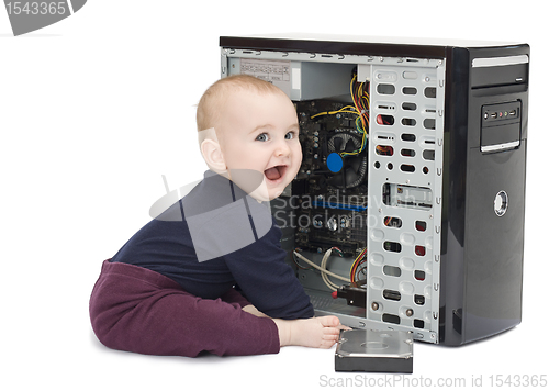 Image of young child with open computer