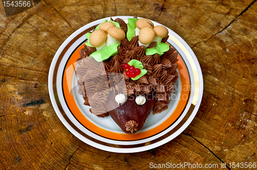 Image of Cake in the form of a hedgehog on a wooden stand