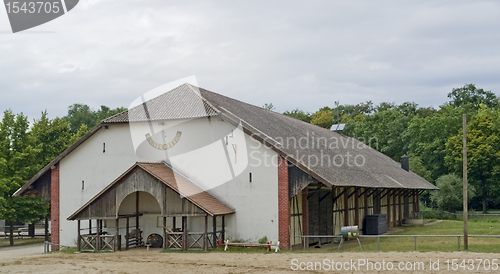 Image of farmstead in cloudy ambiance