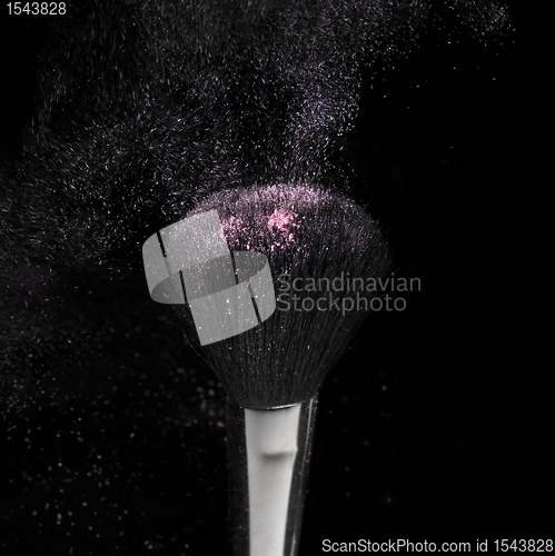 Image of flying make-up and brush