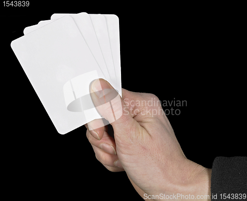 Image of hand and spread cards