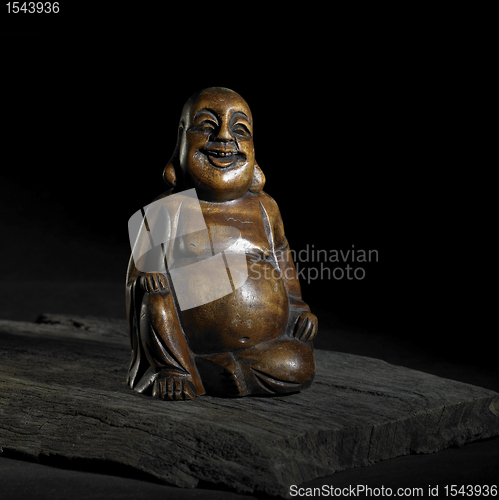 Image of Buddha sculpture in dark back
