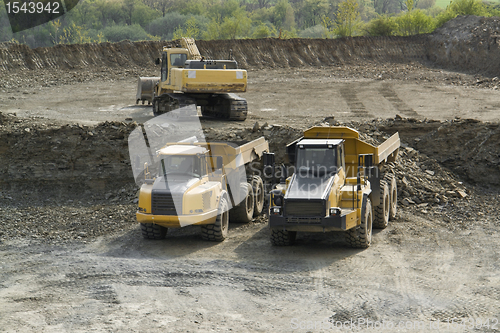 Image of digger and trucks