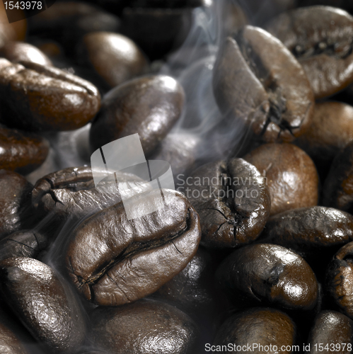 Image of roasted coffee beans and smoke