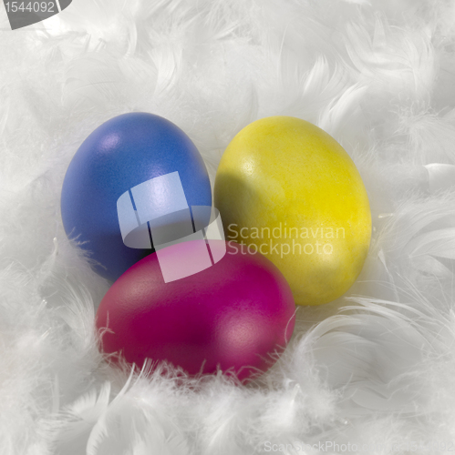 Image of colored Easter eggs and down feathers