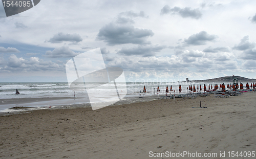 Image of deserted beach and cloudy sky