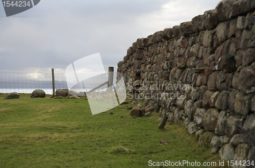 Image of dry stone wall and fence in Scotland