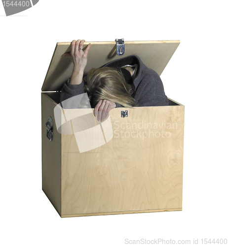 Image of girl sitting in a wooden box