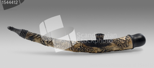 Image of carved exotic pipe made of horn