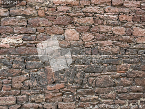 Image of reddish stone wall