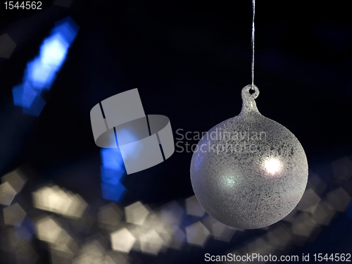 Image of translucent Christmas bauble in dark back