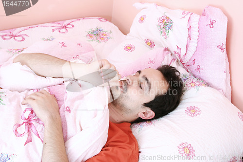 Image of Young man sleeping .