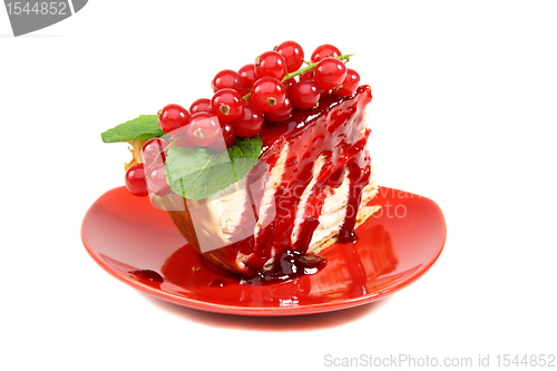 Image of Crepe cake with berry sauce.