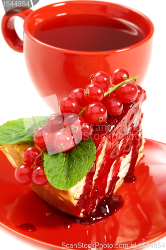 Image of Crepe cake and a red cup of tea.