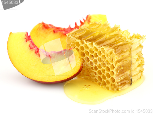 Image of Sweet slices of nectarine with honeycombs