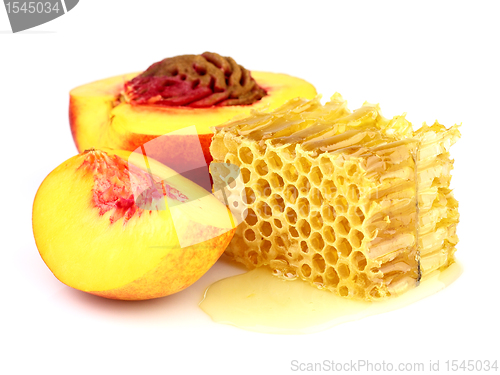 Image of Ripe peach with honeycombs