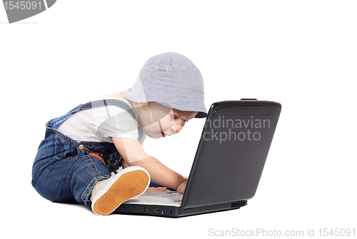 Image of Little boy with a laptop