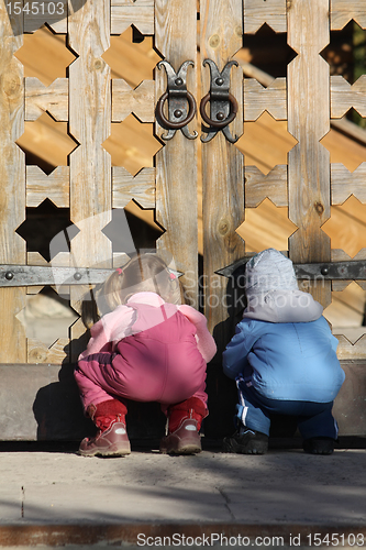 Image of Children near the wooden gates