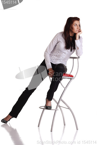 Image of Girl sitting on the bar chair