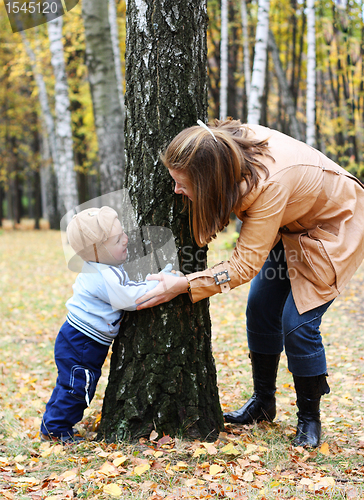 Image of Mother with son play seek and hide