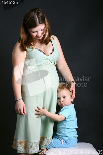 Image of Pregnant women with son