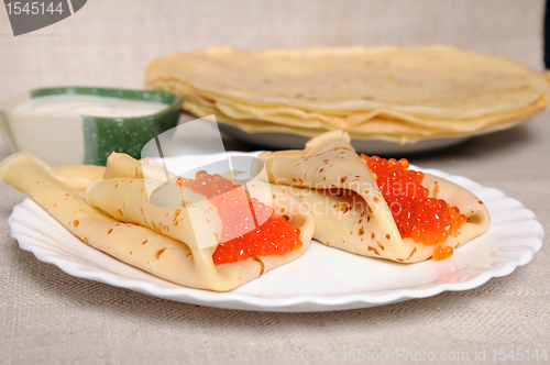 Image of pancake with red caviar