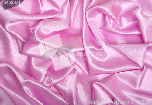 Image of Smooth elegant pink silk as background 