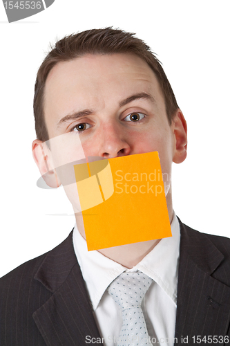 Image of Businessman with a blank  adhesive note over his mouth