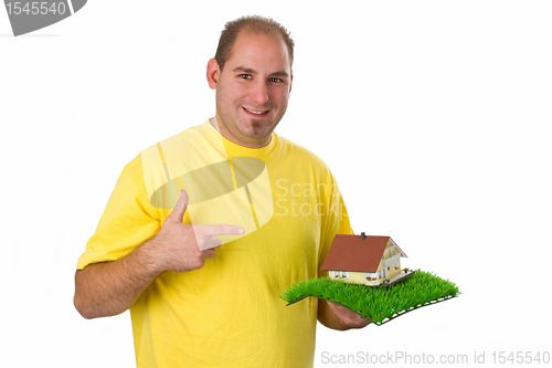 Image of Young man with model house