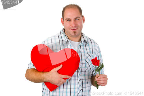 Image of Young man holding red heart