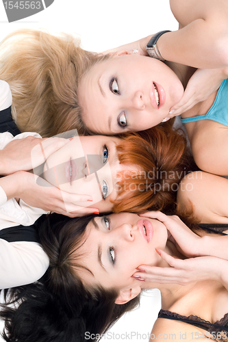 Image of Three disturbed women touching their cheeks