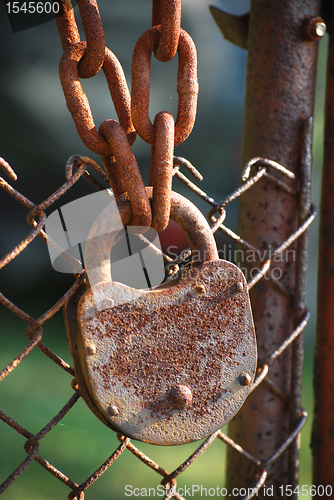 Image of Rusty padlock, iron chain, net