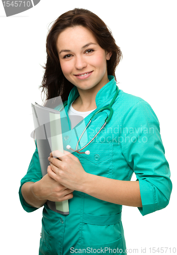 Image of Young attractive woman wearing a doctor uniform