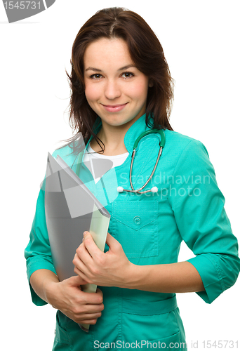Image of Young attractive woman wearing a doctor uniform