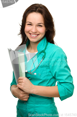 Image of Young attractive woman wearing a doctor uniform