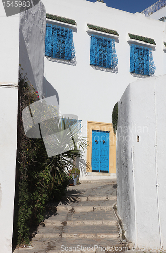 Image of Sidi Bou Said - typical building with white walls, blue doors and windows