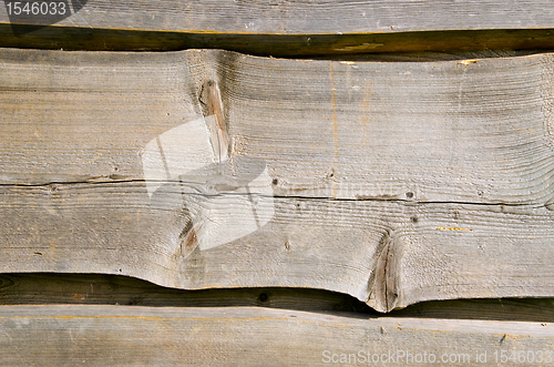 Image of Wooden village house wall carved planks background 