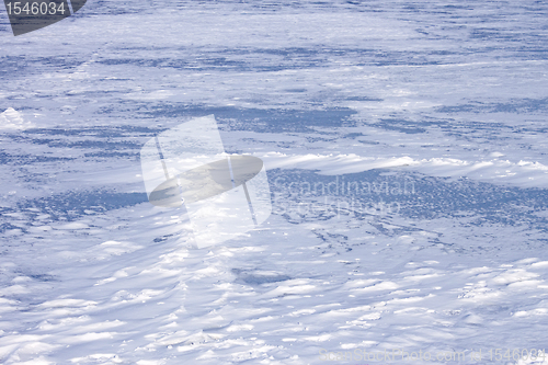 Image of Snow hummocks on frozen reservoir