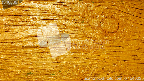 Image of Wooden plank painted in golden