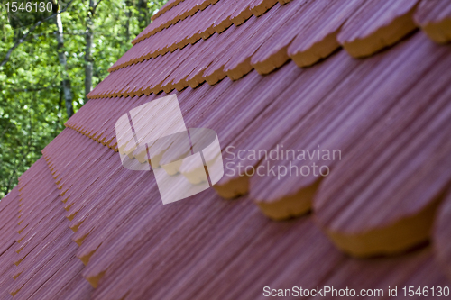 Image of roof tile with part of eaves gutter