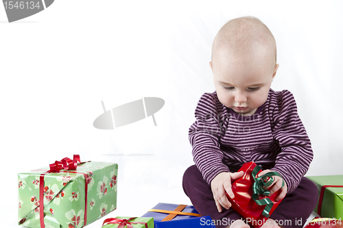 Image of young child unpacking presents