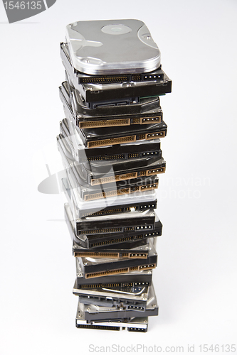 Image of Stack of hard drive with opened one on top