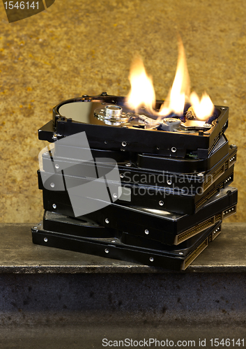 Image of burning stack of hard drives