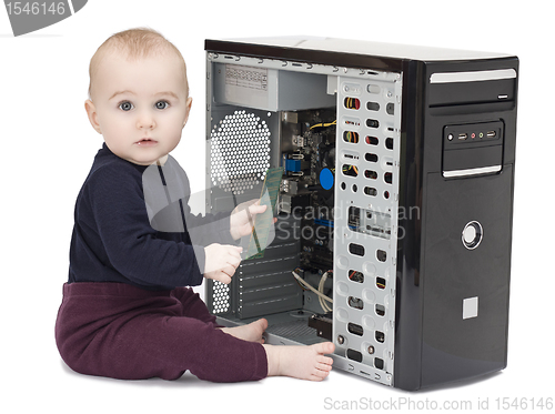 Image of young child with open computer