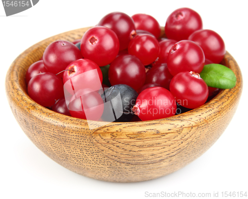 Image of Fresh berries in a wooden plate