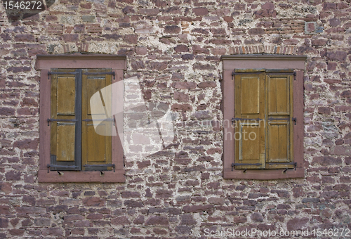 Image of stone wall with old windows