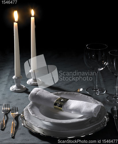 Image of festive place setting and candlelight