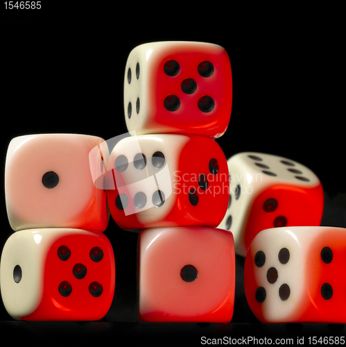 Image of pile of red illuminated white dice