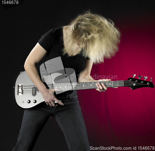 Image of playing bass guitar