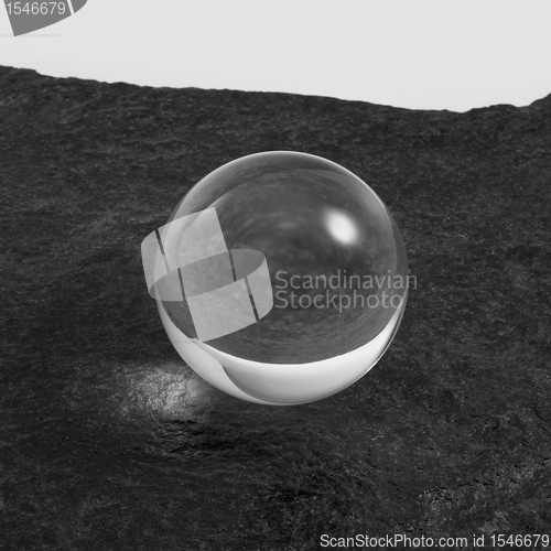 Image of crystal ball on stone surface